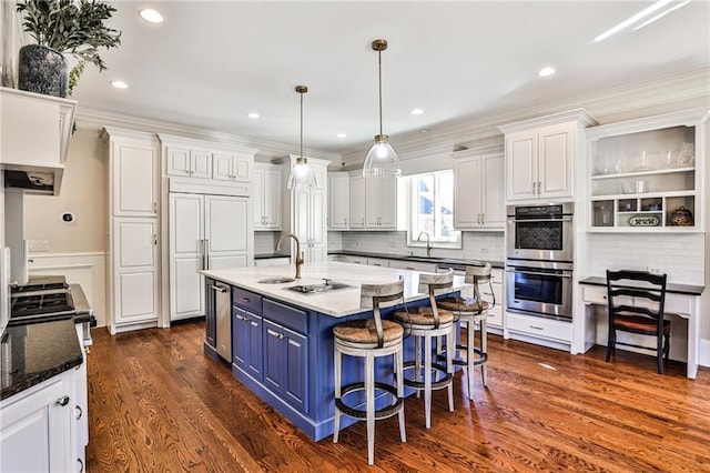 620 Elizabeth Oak Ct, Alpharetta, GA 30004 - kitchen with stainless steel double oven, blue cabinets, white cabinets, a kitchen island with sink, and dark wood-style floors