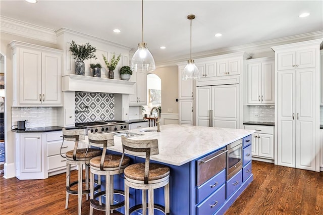 620 Elizabeth Oak Ct, Alpharetta, GA 30004 - kitchen with blue cabinetry, white cabinetry, stainless steel microwave, dark wood-style flooring, and recessed lighting