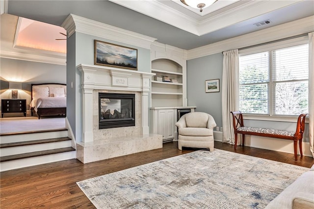 620 Elizabeth Oak Ct, Alpharetta, GA 30004 - sitting room featuring a fireplace, crown molding, dark wood-style floors, and built in shelves