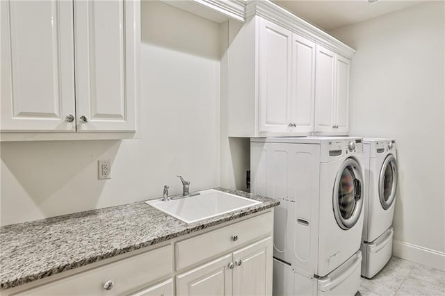 620 Elizabeth Oak Ct, Alpharetta, GA 30004 - laundry area featuring cabinet space and washer and clothes dryer