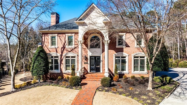 620 Elizabeth Oak Ct, Alpharetta, GA 30004 - view of front facade with a chimney and brick siding