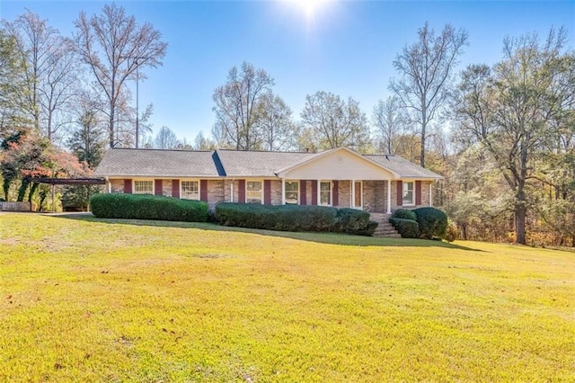 ranch-style home with a front yard