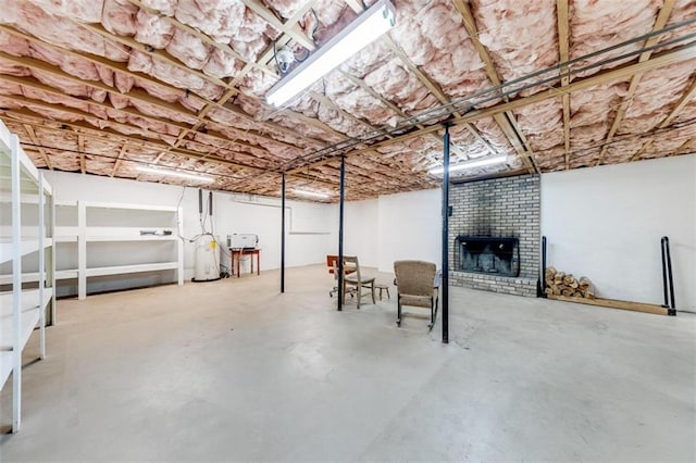 basement with a brick fireplace