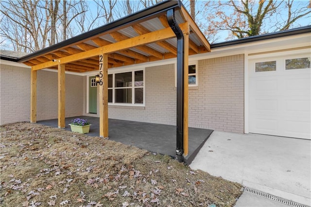 view of patio with a garage