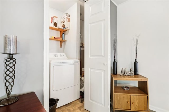 laundry room featuring laundry area and washer / dryer