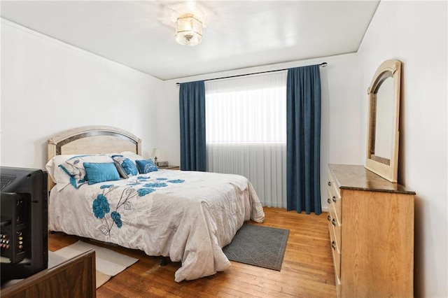 bedroom with light wood-style floors