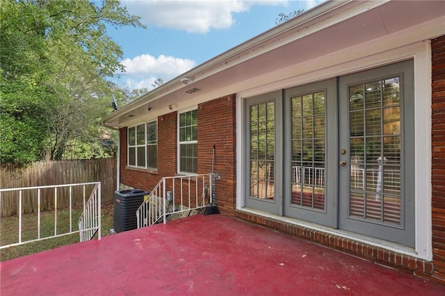 view of patio / terrace featuring cooling unit and fence