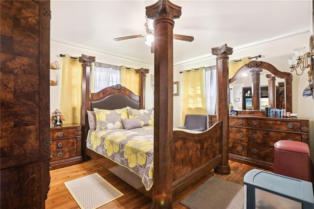 bedroom with wood finished floors and a ceiling fan