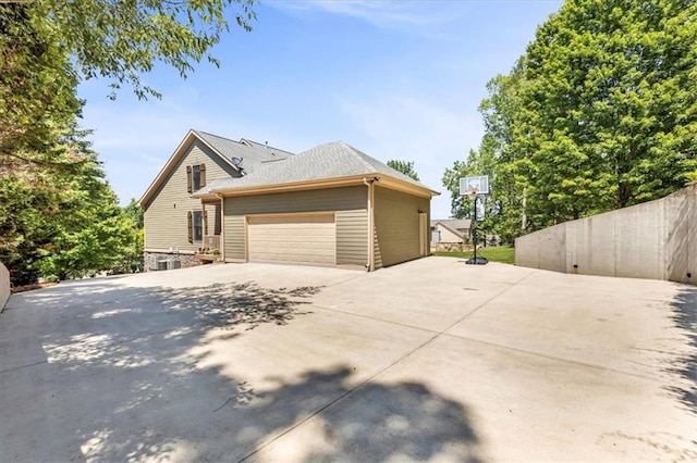 view of property exterior with fence