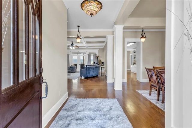 entrance foyer with ornate columns, baseboards, wood finished floors, a ceiling fan, and coffered ceiling
