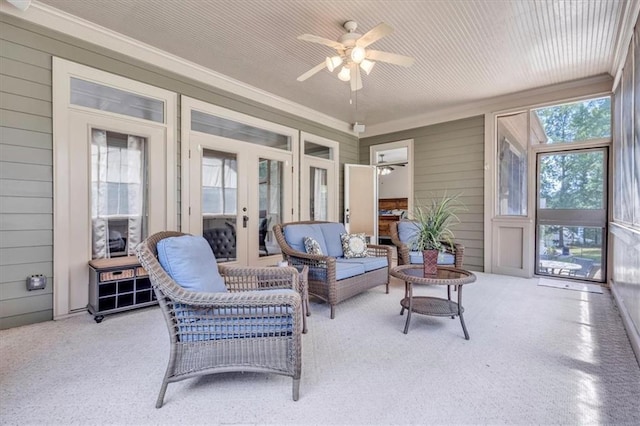 sunroom / solarium featuring an outdoor living space, french doors, and a ceiling fan