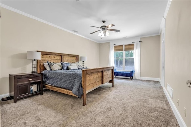 bedroom with baseboards, ornamental molding, visible vents, and light colored carpet