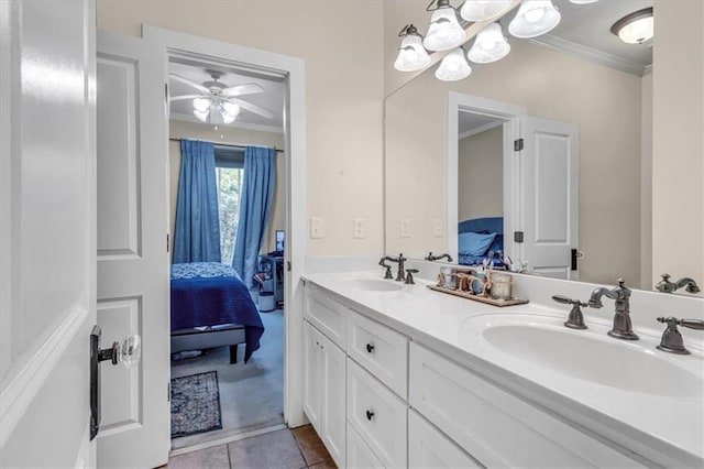 ensuite bathroom featuring connected bathroom, double vanity, ornamental molding, and a sink