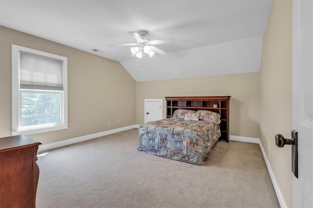 bedroom featuring visible vents, carpet, baseboards, ceiling fan, and lofted ceiling