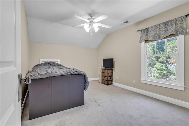 bedroom with visible vents, baseboards, ceiling fan, lofted ceiling, and carpet floors