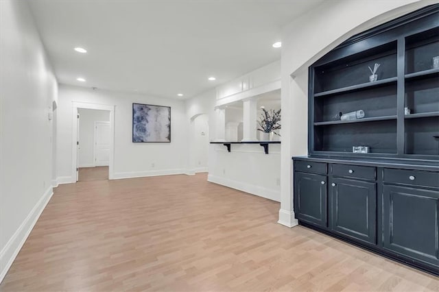 bar with baseboards, light wood-type flooring, and recessed lighting
