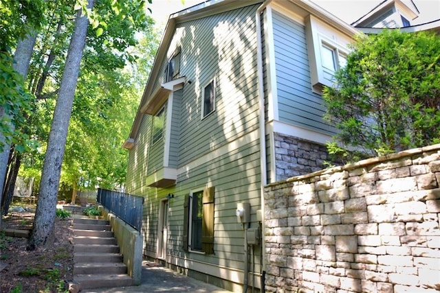 view of property exterior with stairway