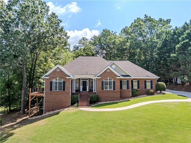 31 Bluff Mountain Dr, Rome, GA 30165 - view of front of property featuring brick siding, a front yard, and a deck