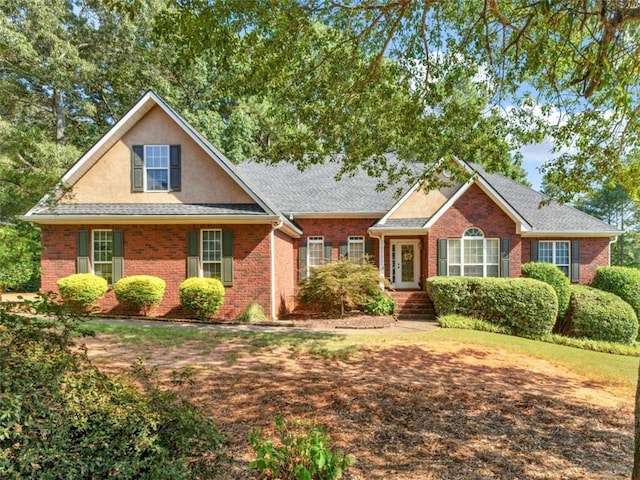 925 Champions Way, Mcdonough, GA 30252 - view of front of home with brick siding and roof with shingles