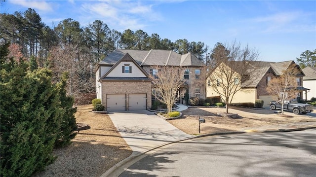 view of front of house featuring concrete driveway and a garage