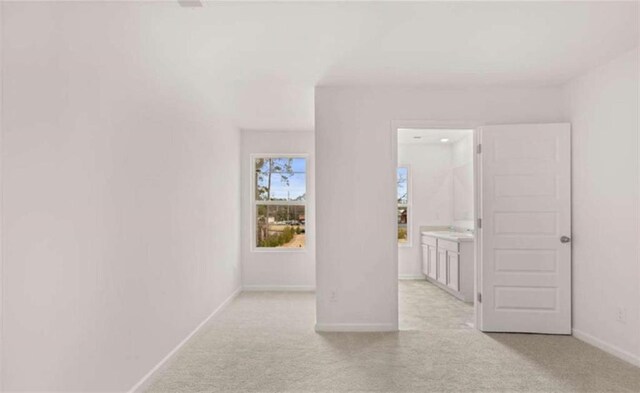 11408 Gray Branch Dr, Lawrenceville, GA 30045 - unfurnished bedroom with light carpet, baseboards, and ensuite bath
