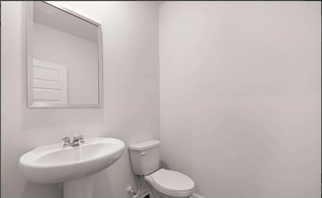 11408 Gray Branch Dr, Lawrenceville, GA 30045 - bathroom with toilet and a sink
