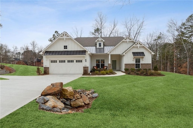 view of front of house with a garage and a front lawn