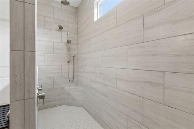 bathroom featuring tiled shower