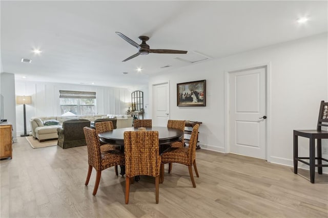 dining area with ceiling fan and light hardwood / wood-style flooring