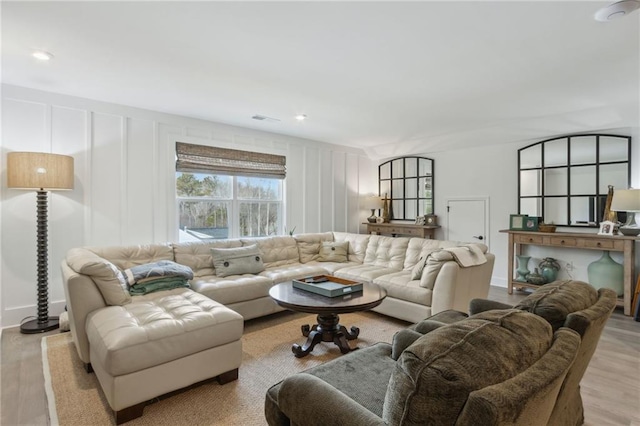 living room with light hardwood / wood-style flooring