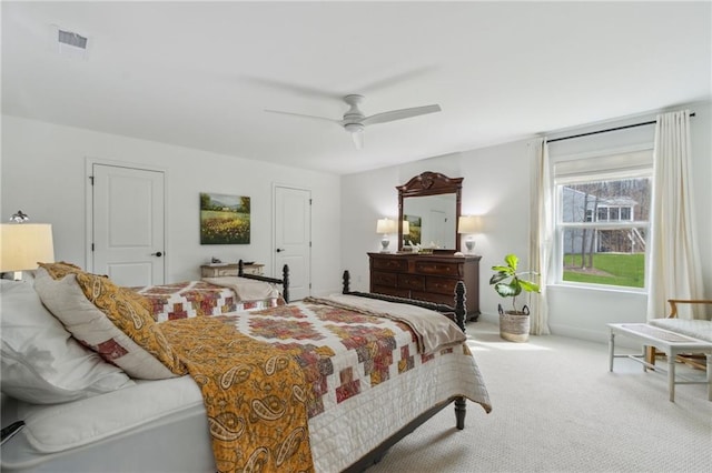 carpeted bedroom with ceiling fan