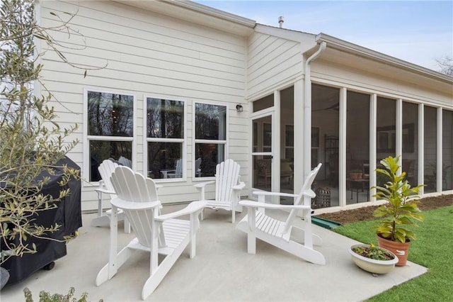 view of patio / terrace featuring a sunroom