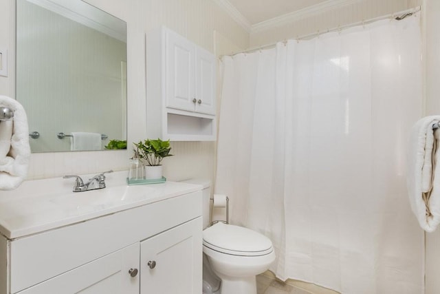 bathroom with tile patterned flooring, crown molding, vanity, and toilet