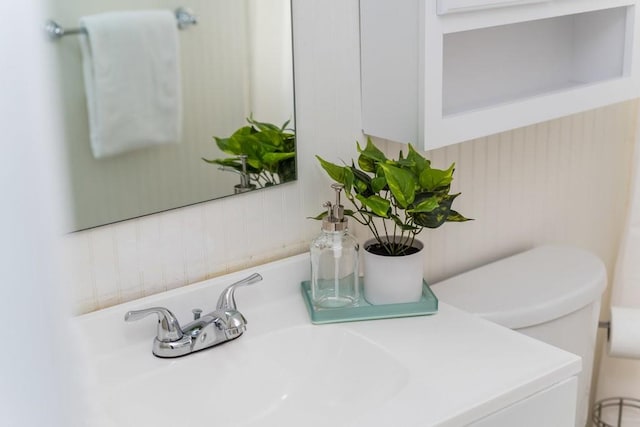 interior details with vanity and toilet