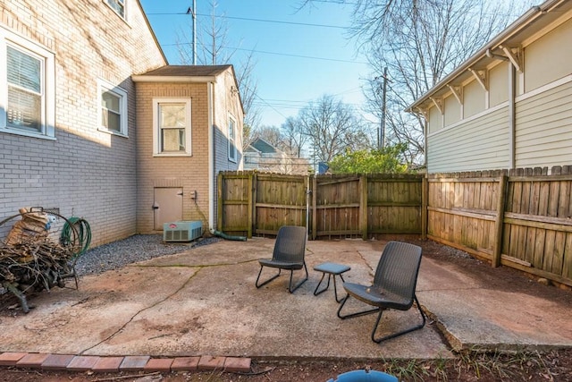 view of patio with a gate and fence