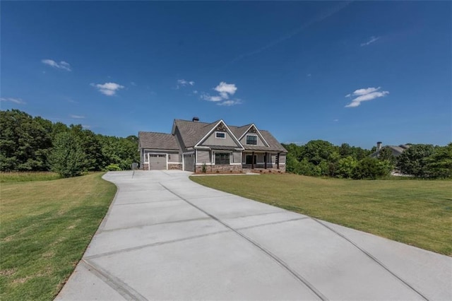 craftsman-style home with a garage and a front yard