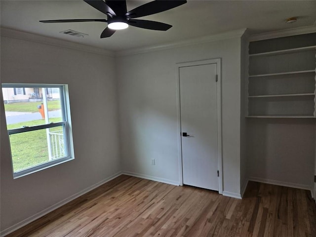 775 Lee Andrews Ave SE, Atlanta, GA 30315 - unfurnished bedroom with crown molding, wood finished floors, baseboards, and a ceiling fan