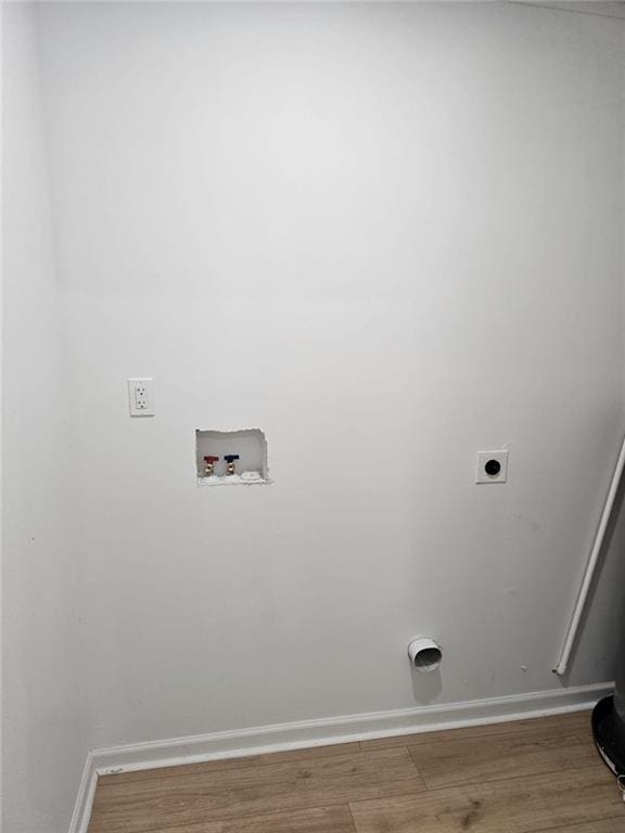 775 Lee Andrews Ave SE, Atlanta, GA 30315 - washroom with hookup for a washing machine, hookup for an electric dryer, wood finished floors, and baseboards