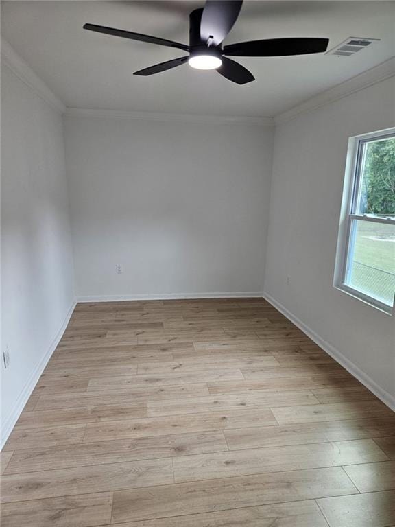 775 Lee Andrews Ave SE, Atlanta, GA 30315 - spare room with a ceiling fan, light wood-type flooring, crown molding, and baseboards