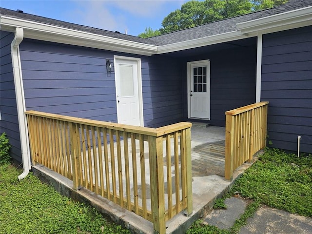 775 Lee Andrews Ave SE, Atlanta, GA 30315 - view of exterior entry featuring a wooden deck and roof with shingles