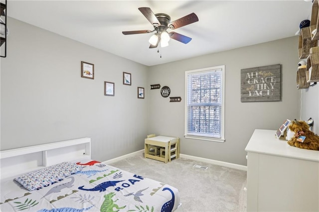 bedroom with light carpet and ceiling fan