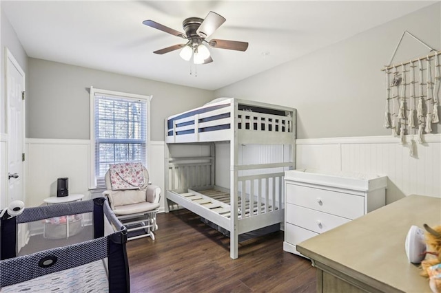 bedroom featuring ceiling fan and dark wood-type flooring