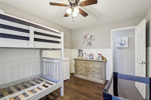 bedroom with ceiling fan and dark hardwood / wood-style floors