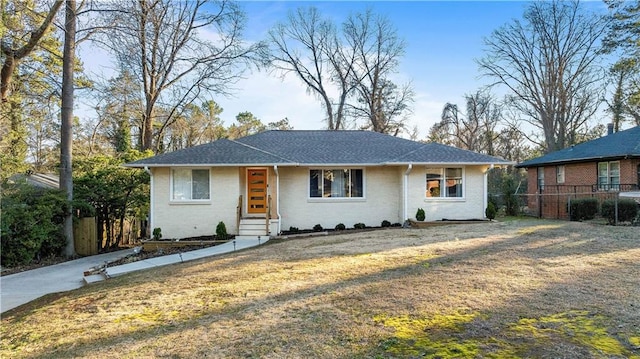 ranch-style house with a front lawn