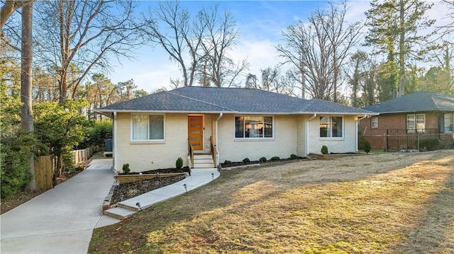 ranch-style home with a front yard