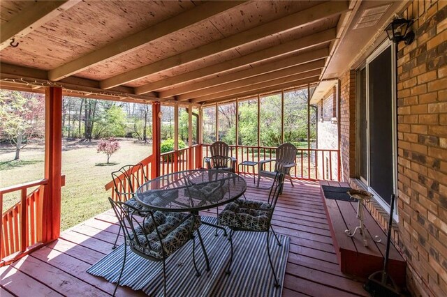 wooden deck with outdoor dining area