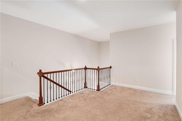 spare room with light colored carpet