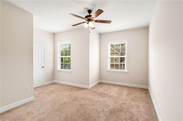 carpeted empty room with ceiling fan