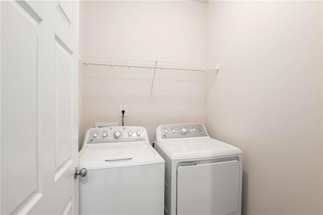 washroom featuring independent washer and dryer