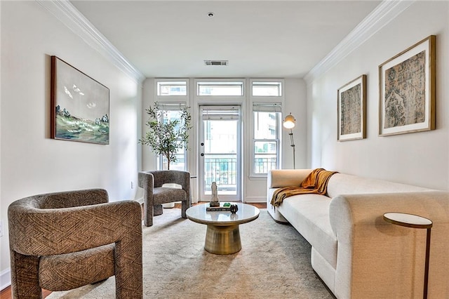 sitting room featuring hardwood / wood-style floors and ornamental molding